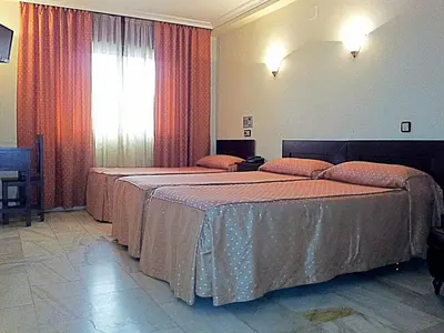 Cama o camas de una habitación en Hotel Averroes