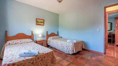 Cama o camas de una habitación en Casa Madrona Periana by Ruralidays