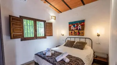 Cama o camas de una habitación en La Casita del Sabinal Álora by Ruralidays