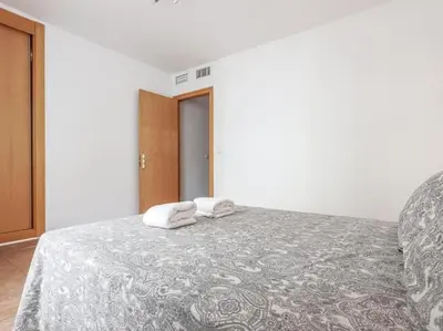 Cama o camas de una habitación en Alojamiento con piscina en Sevilla