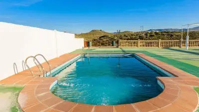 Piscina en o cerca de Cortijo Vaquero Rural Loja by Ruralidays