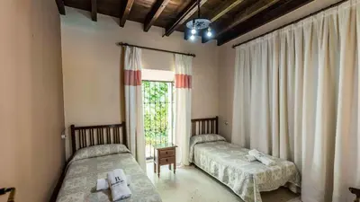 Cama o camas de una habitación en Cortijo Coracho Osuna by Ruralidays