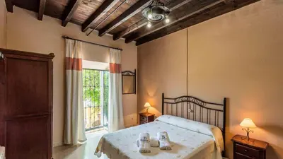 Cama o camas de una habitación en Cortijo Coracho Osuna by Ruralidays