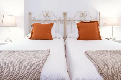Cama o camas de una habitación en Apartamento con encanto en patio sevillano (203)