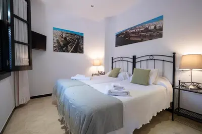 Cama o camas de una habitación en Apartamento con encanto en patio sevillano (204)