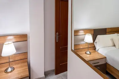 Cama o camas de una habitación en Alohamundi Feria