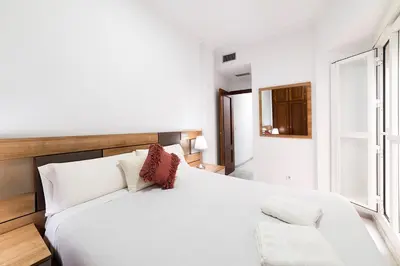 Cama o camas de una habitación en Alohamundi Feria