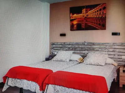 Cama o camas de una habitación en loft Alameda de Hercules