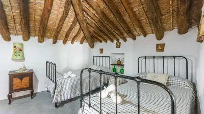 Cama o camas de una habitación en Huerta La Lapa Cañete la Real by Ruralidays