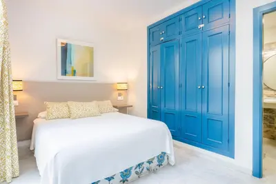 Cama o camas de una habitación en Smartr Sevilla Las Dueñas