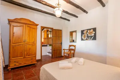 Cama o camas de una habitación en El Chorro Villas Casa Adelfa