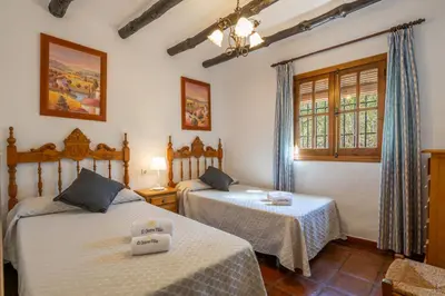 Cama o camas de una habitación en El Chorro Villas Casa Adelfa