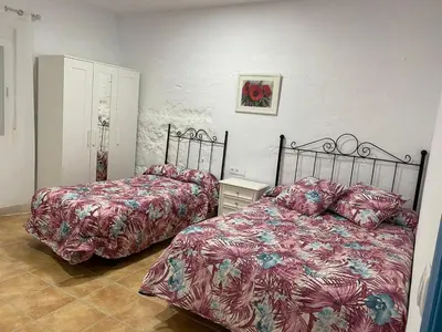 Cama o camas de una habitación en La casa del olivo