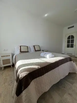 Cama o camas de una habitación en ATICO SUITE CLAUDIO MARCELO