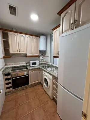 Una cocina o zona de cocina en ATICO SUITE CLAUDIO MARCELO