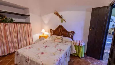Cama o camas de una habitación en Huerta Nueva Cuevas del Becerro by Ruralidays
