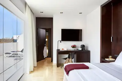 Una televisión o centro de entretenimiento en Hotel Posada del Lucero