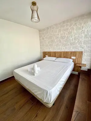 Cama o camas de una habitación en Apartamentos Rey