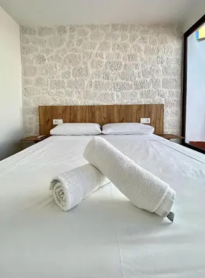 Cama o camas de una habitación en Apartamentos Rey