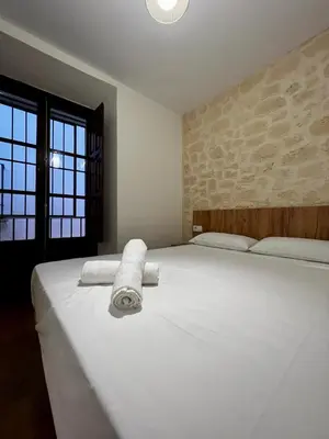 Cama o camas de una habitación en Apartamentos Rey