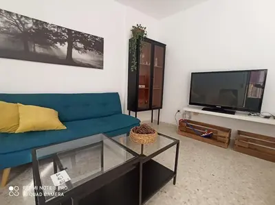 Una televisión o centro de entretenimiento en Apartamento baños Árabes