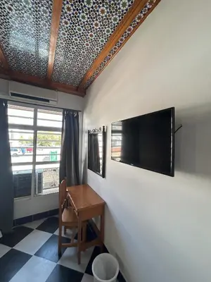 Una televisión o centro de entretenimiento en Hostal el Ancla