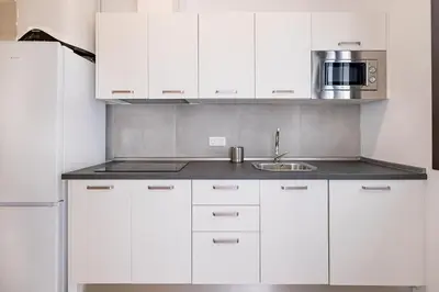 Una cocina o zona de cocina en BHost - Regina V