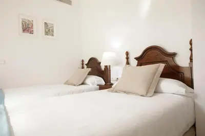 Cama o camas de una habitación en Hotel San Miguel