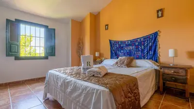 Cama o camas de una habitación en Casa Ginés Iznájar by Ruralidays