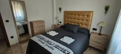 Cama o camas de una habitación en Cuadro de la Virgen - Vivienda Turistica