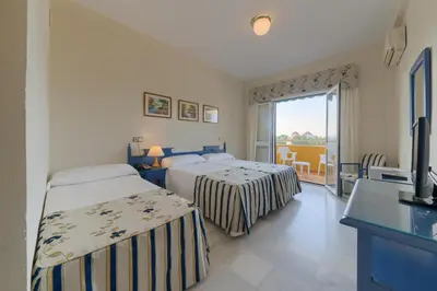 Cama o camas de una habitación en Hotel Torre De Los Guzmanes