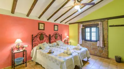 Cama o camas de una habitación en Combinación Cortijo y Mirador Casablanca Priego de Córdoba by Ruralidays