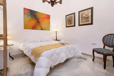 Cama o camas de una habitación en Judería Suites