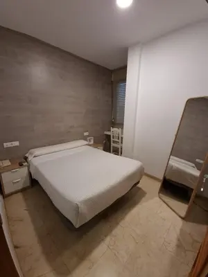 Cama o camas de una habitación en Hotel Gran Plaza