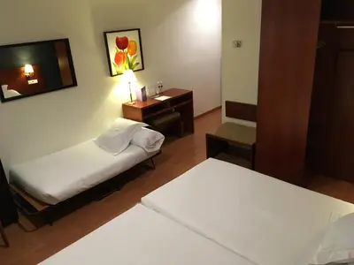 Cama o camas de una habitación en TRH Ciudad de Baeza