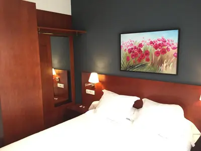 Cama o camas de una habitación en TRH Ciudad de Baeza