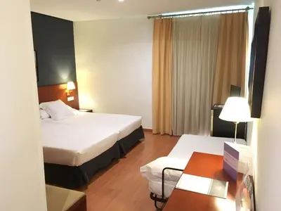 Cama o camas de una habitación en TRH Ciudad de Baeza