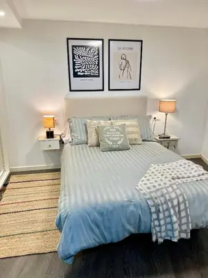 Cama o camas de una habitación en El patio de Lindo