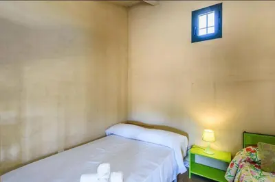 Cama o camas de una habitación en Casa Cortijo en Dehesa Sierra León