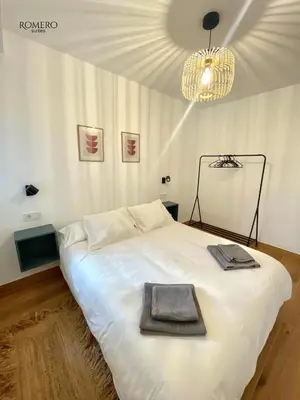 Cama o camas de una habitación en Romero Suites 1