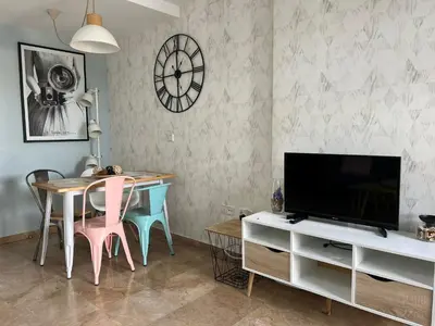Una televisión o centro de entretenimiento en Apartamento La Magdalena