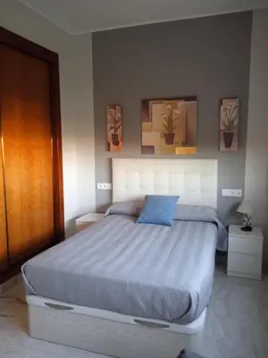 Cama o camas de una habitación en FIBES Lux Sevilla Este.