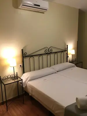 Cama o camas de una habitación en Hospedería Luis de Góngora