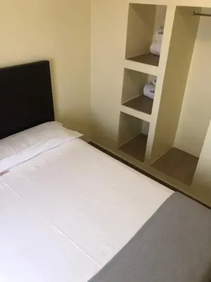 Cama o camas de una habitación en Hospedería Luis de Góngora