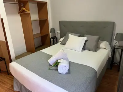 Cama o camas de una habitación en Hospedería Luis de Góngora