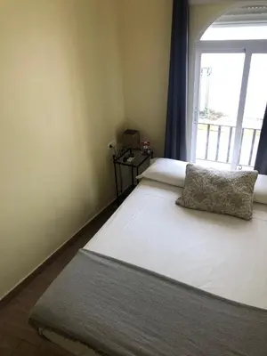 Cama o camas de una habitación en Hospedería Luis de Góngora