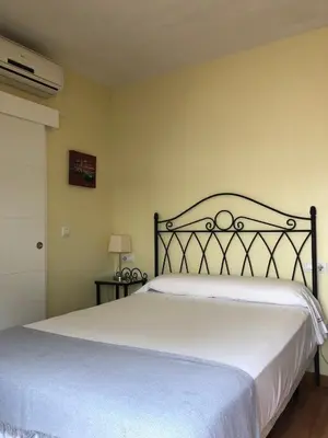 Cama o camas de una habitación en Hospedería Luis de Góngora