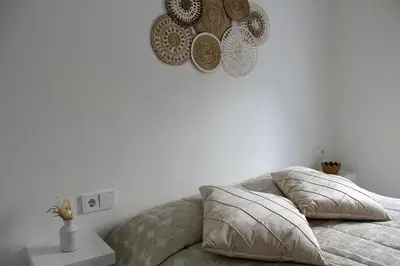 Cama o camas de una habitación en WISH SUITE SAN BARTOLOME DE SEVILLA