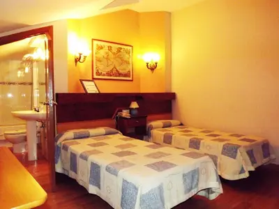 Cama o camas de una habitación en Hotel Castilla