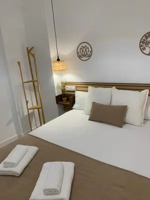 Cama o camas de una habitación en APARTAMENTO MEDINA AZAHARA